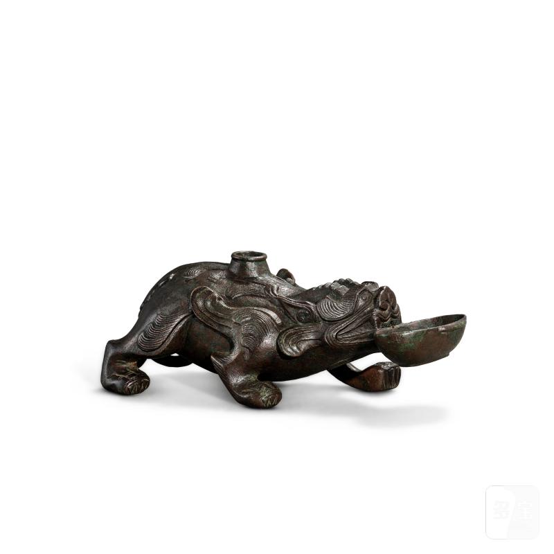 A bronze 'mythical beast' water dropper, Six dynasties | 六朝 銅瑞獸形硯滴